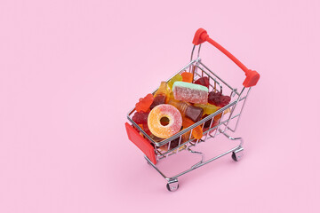 jelly candies in shopping basket full of delicious multicolored marmalade with natural juice sweet