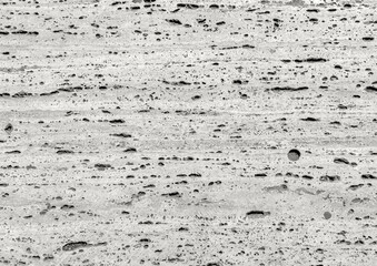 Cloud Dancer, trendy off-white color of the Year 2026. Porous stone texture with scattered dark pits