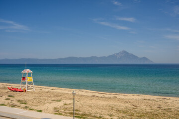 Empty shoreline without people and turquoise water at Sarti Beach, Greece