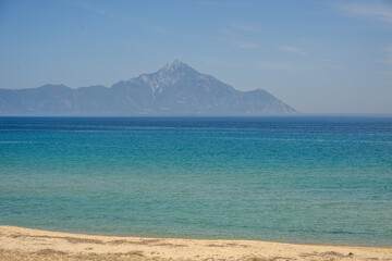 Empty shoreline without people and turquoise water at Sarti Beach, Greece