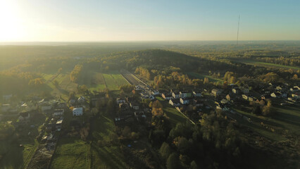 Autumn countryside village surrounded by colorful trees
