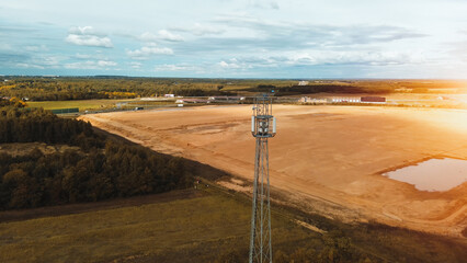 Rural telecom tower under a clear blue sky
