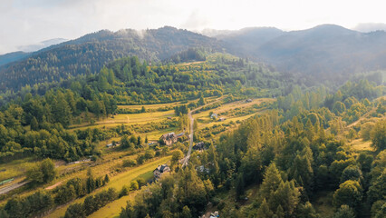 Riverfront village surrounded by green hills