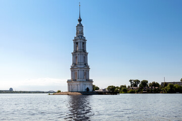 The flooded bell tower of St. Nicholas Cathedral rises above the surface of the Volga River. Kalyazin, Tver region.