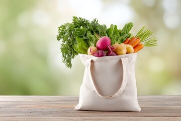 Fresh vegetables overflowing from canvas bag on wooden table outdoors