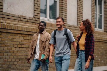 University students walking and talking on campus