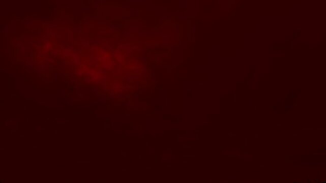 Wide shot of gloomy, layered red storm clouds covering the sky. Atmospheric background for sad, dramatic, or horror scenes