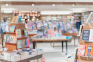 Naklejka premium Bookstore blur for background, Books magazine shelf display in shop center abstract for background.