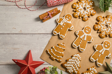 Holiday background. Christmas gingerbread cookies with icing flat lay, festive food, copy space