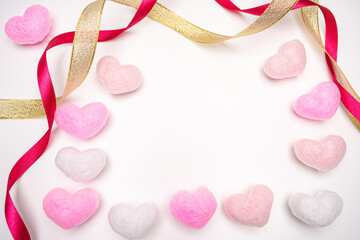 Valentine's Day background with pink heart and red-gold ribbon