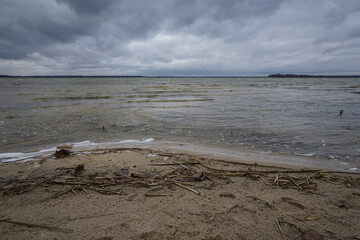 Lake in windy and cloudy weather. Autumn