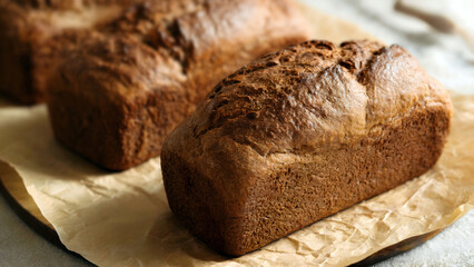 Golden brown loaves of artisan bread fresh from the oven baking for restaurants and cafes