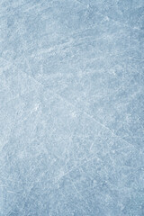An ice surface as an ice rink with ice skates tracks. Winter sports texture. Poster with copy space.
