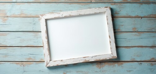 Empty distressed white frame rests on weathered blue wood planks. Use this blank canvas for beach vacation, coastal decor, or summer event announcements. Perfect for adding text or image.