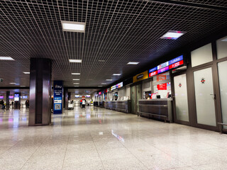 Naklejka premium Airport Krakow terminal in Poland with check-in counters and service desks in a modern hall