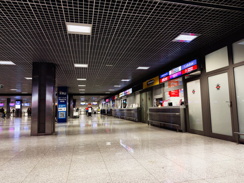 Airport Krakow terminal in Poland with check-in counters and service desks in a modern hall