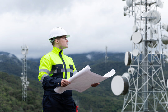Engineer inspecting communication towers for 5G and 6G network deployment - Powered by Adobe