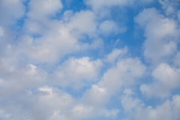 The sky is blue with white clouds scattered throughout