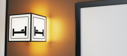 Illuminated hotel room sign with bed icon mounted on wall in modern interior hallway setting, warm lighting and empty frame beside it. 3D Rendering
