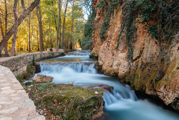 Monasterio de Piedra river cascades flowing through autumn landscape