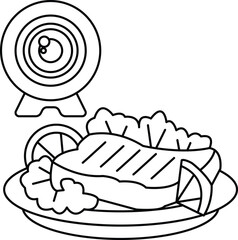 A camera is on a plate with a piece of meat and some lettuce