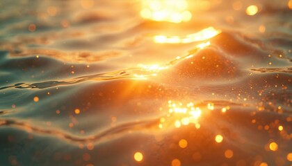 Abstract photo of water surface illuminated by sunlight. Golden sparkling water with bokeh effect. Tranquil, calm ocean waves create serene background scene. Shiny water reflects sun light at summer