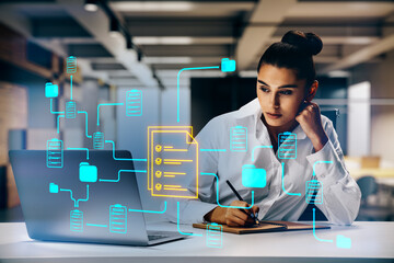 Businesswoman working on digital document management system with neon data icons and workflow connections on laptop in modern office workspace.