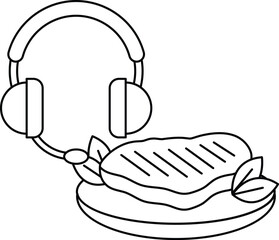 A hamburger with a piece of meat on top of a plate with a pair of headphones on