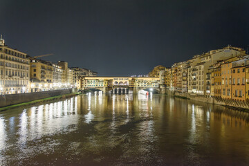 Ponte Vecchio illuminated over the Arno River at night, Florence, Italy