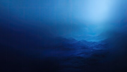 Deep underwater landscape featuring a glowing light and misty terrain