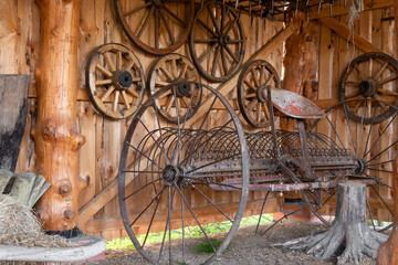 Vintage agricultural machinery and equipment in a farmyard in the countryside