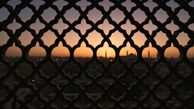 Ornate arabesque screen silhouettes against an arabic cityscape at sunset, showcasing a traditional pattern and a changing sky.