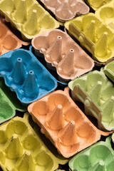 Open empty egg boxes viewed at an angle