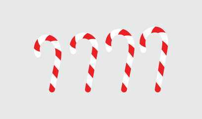 Four candy canes with red stripes dripping on a gray background