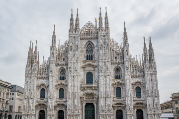 Fototapeta premium Duomo di Milano, Front view of Milan Cathedral with marble spires, Milan, Italy