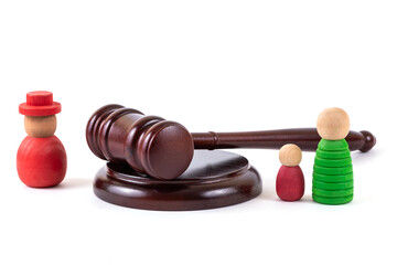 A conceptual story about a family divorce or alimony payments with a judge's gavel and symbolic figures of people