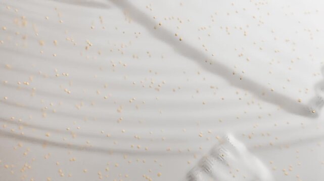 Transparent cosmetic gel smear with particles closeup, Exfoliating Scrub Fluid, Skincare peeling swatch smudge. Beauty Cleansing Liquid. Organic viscous Cosmetics Product texture with beads, face or