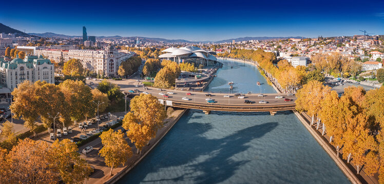 Tbilisi cityscape with Public Service Hall and bridge over Mtkvari