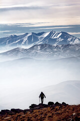Climber above the clouds