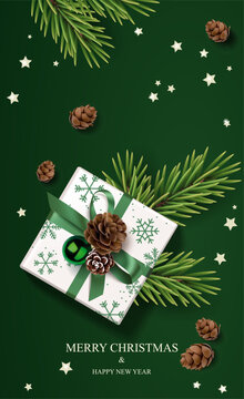Christmas and New Year vertical card with decorative gift box, green ball and spruce branch. Vector illustration	