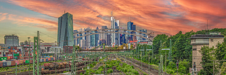 Frankfurt City Skyline and Rail Yard at Sunset with Dramatic Orange Sky and Copy Space
