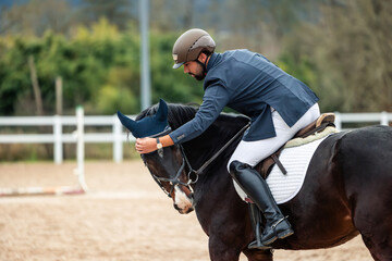 Rider bonding with horse during equestrian competition