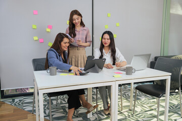 Human resource managers interview women for job, meet at office, consult, people work on project, analyze data using laptop tablet and calculator, sharing ideas, fostering collaboration