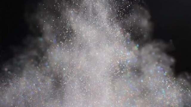 Glistening Dust Cloud Against Black Backdrop