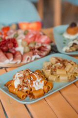 Elegant Italian aperitif with prosecco and warm gourmet dishes