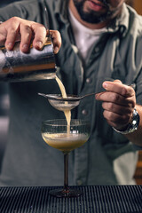 Professional bartender preparing a drink