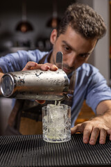 Bartender pouring ingredients