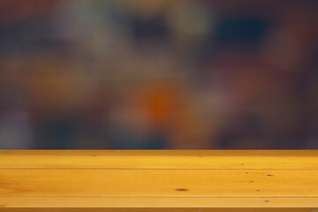 Wooden table surface with black bokeh blurred background for product placement