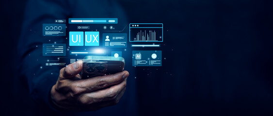 Business hand holding a smartphone with floating UI UX interface elements, digital screens, analytics, and AI icons on a futuristic dark background, representing modern mobile app and technology.