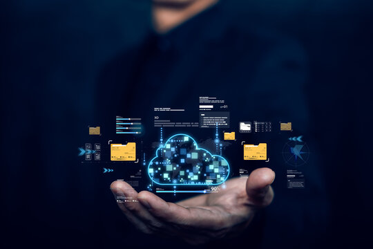 A hand presenting a digital cloud icon with data files and futuristic interface elements, symbolizing cloud storage, data management, and modern technology on a dark background. - Powered by Adobe